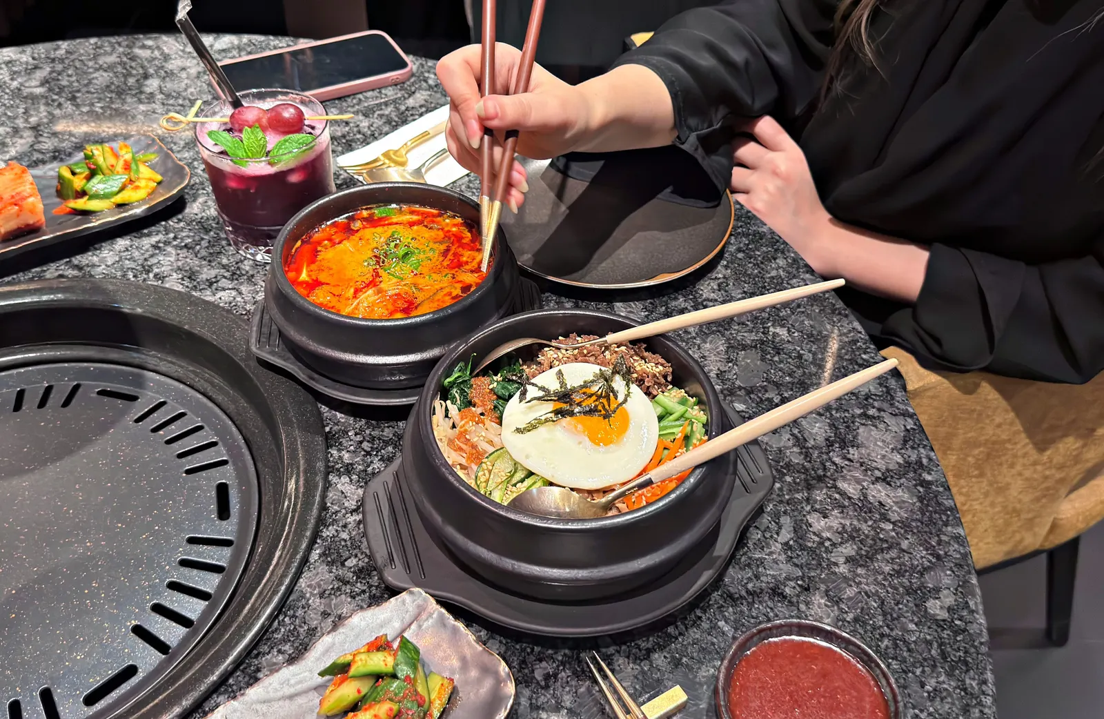 Friends eating out at a Korean restaurant